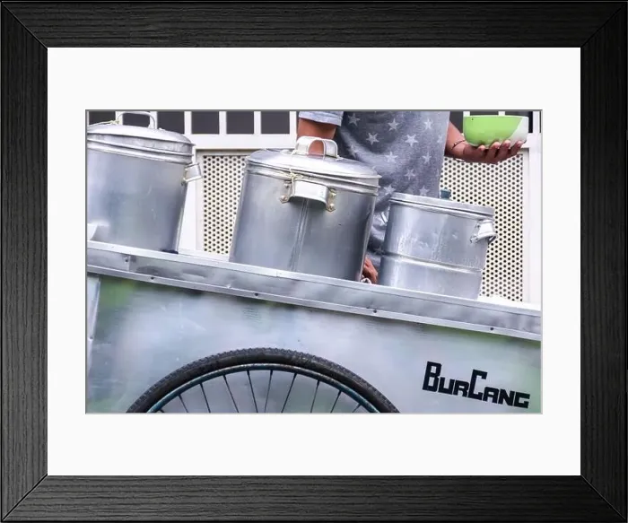 Framed Print : man street food seller serving the indonesian traditional green bean porridge on his silver cart Framed Print : man street food seller serving the indonesian traditional green bean porridge on his silver cart