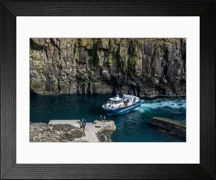 Framed Print : Ferry passes dramatic cliffs on its way to dock Framed Print : Ferry passes dramatic cliffs on its way to dock