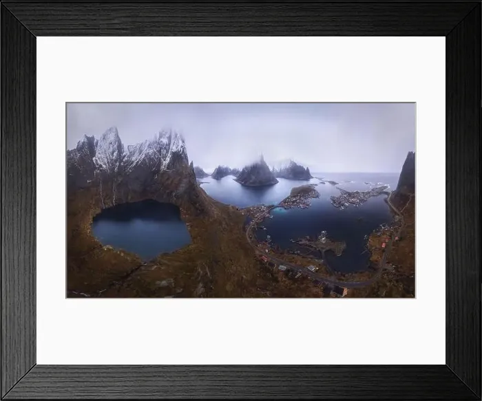 Framed Print : Aerial view of calm water of sea washing island with rocky formations under cloudy sky Framed Print : Aerial view of calm water of sea washing island with rocky formations under cloudy sky