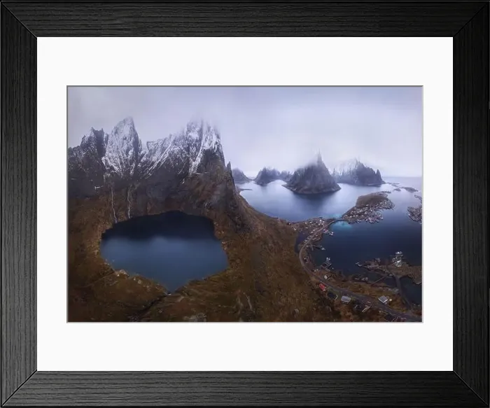 Framed Print : Aerial view of calm water of sea washing island with rocky formations under cloudy sky Framed Print : Aerial view of calm water of sea washing island with rocky formations under cloudy sky