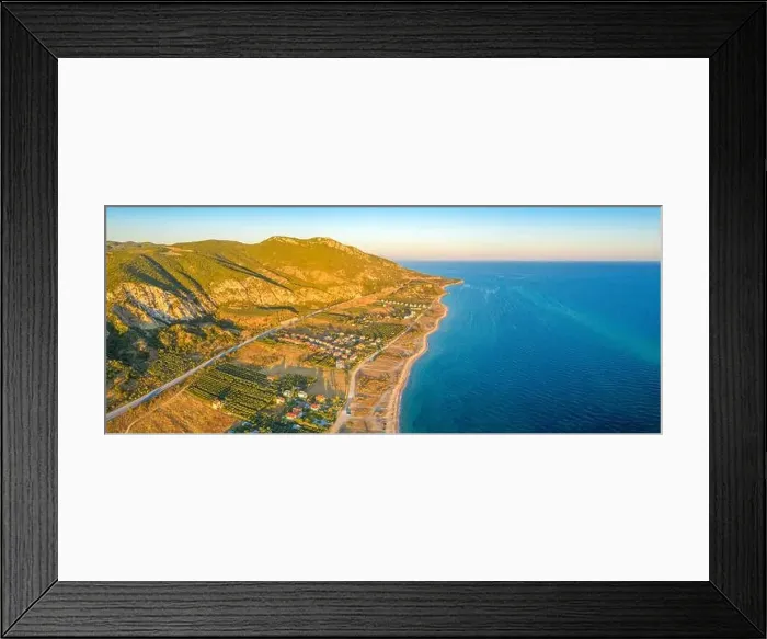 Framed Print : Aerial panorama of a small Greek village on the coast of the Mediterranean sea