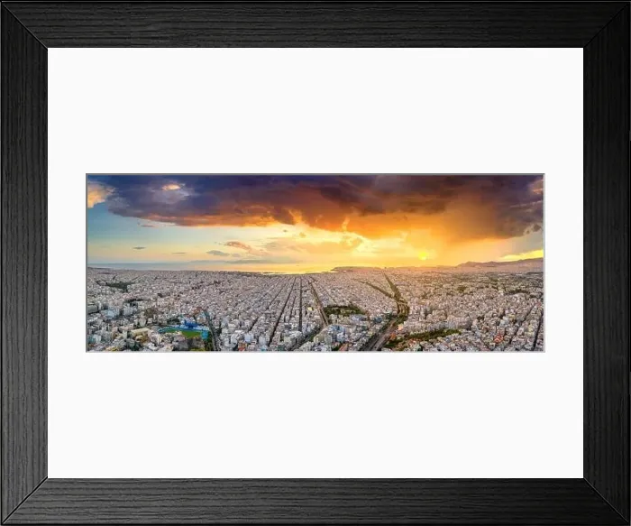 Framed Print : Aerial drone panoramic view of the Greek capital Athens at sunset with a sky overcast with storm clouds Framed Print : Aerial drone panoramic view of the Greek capital Athens at sunset with a sky overcast with storm clouds