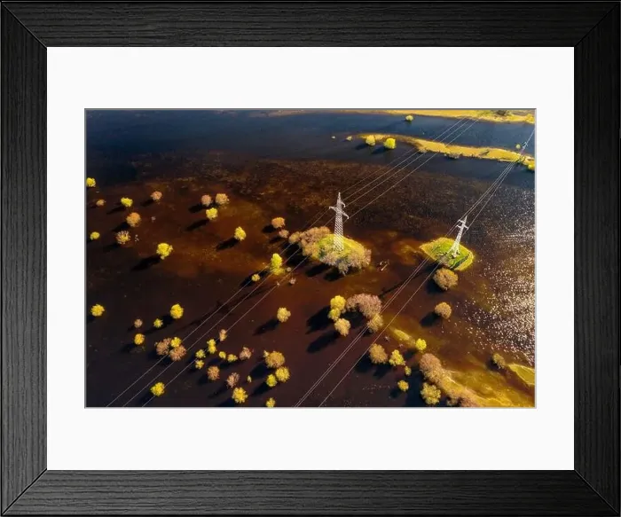 Framed Print : Power lines going through flooded meadows aerial. Floodplains of river Pripyat Framed Print : Power lines going through flooded meadows aerial. Floodplains of river Pripyat