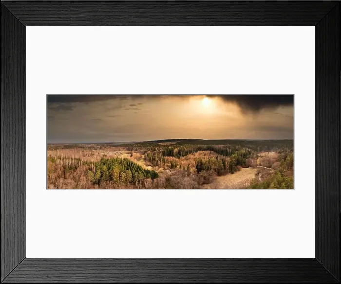 Framed Print : Beautiful dramatic sunset with dark clouds and sun in countryside shot from a drone Framed Print : Beautiful dramatic sunset with dark clouds and sun in countryside shot from a drone