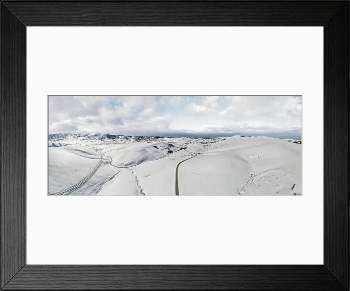 Framed Print : Zlatibor mountain in winter. Beautiful aerial rural landscape with curving road and hills in winter Framed Print : Zlatibor mountain in winter. Beautiful aerial rural landscape with curving road and hills in winter