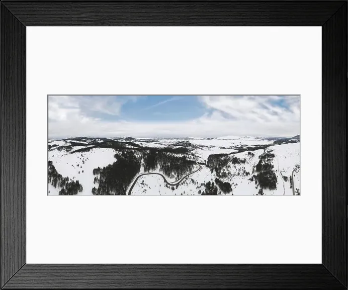 Framed Print : Aerial view of mountain landscape with road and lake in beautiful winter environment Framed Print : Aerial view of mountain landscape with road and lake in beautiful winter environment