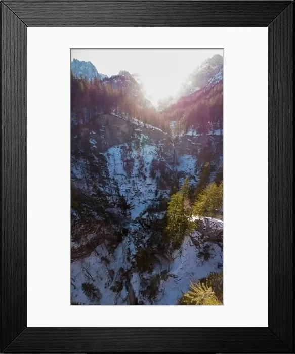 Framed Print : Spectacular drop down view of waterfall falling over rocky forest ledge