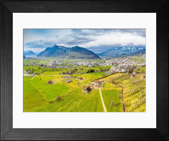 Framed Print : Village in Switzerland. Canton of Schwyz. Panorama aerial view from a drone Framed Print : Village in Switzerland. Canton of Schwyz. Panorama aerial view from a drone