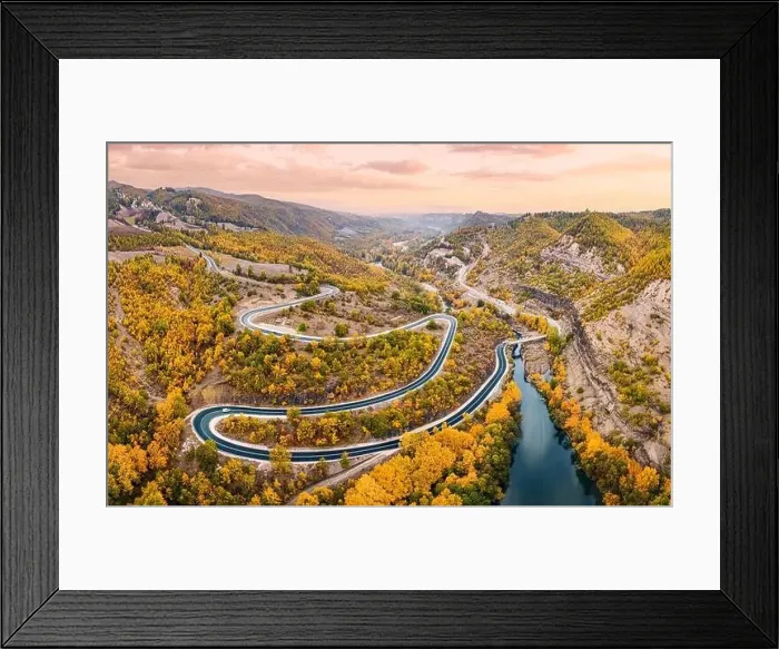 Framed Print : Aerial panoramic view of Venetikos river and serpentine highway road in autumn forest in Balkan Greece Framed Print : Aerial panoramic view of Venetikos river and serpentine highway road in autumn forest in Balkan Greece