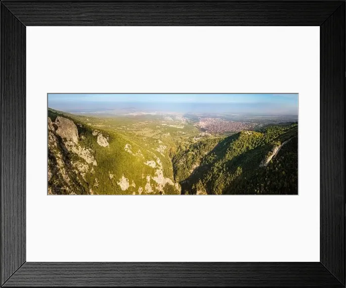 Framed Print : Aerial drone panoramic view of deep gorge and rocky ridge near Mountain Olympus and Litochoro village in the distance Framed Print : Aerial drone panoramic view of deep gorge and rocky ridge near Mountain Olympus and Litochoro village in the distance