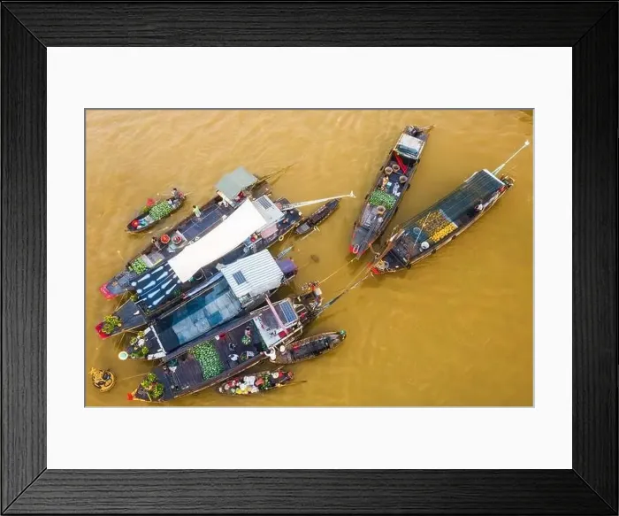 Framed Print : Cai Rang floating market is bustling with Tet boats to welcome the new year Framed Print : Cai Rang floating market is bustling with Tet boats to welcome the new year