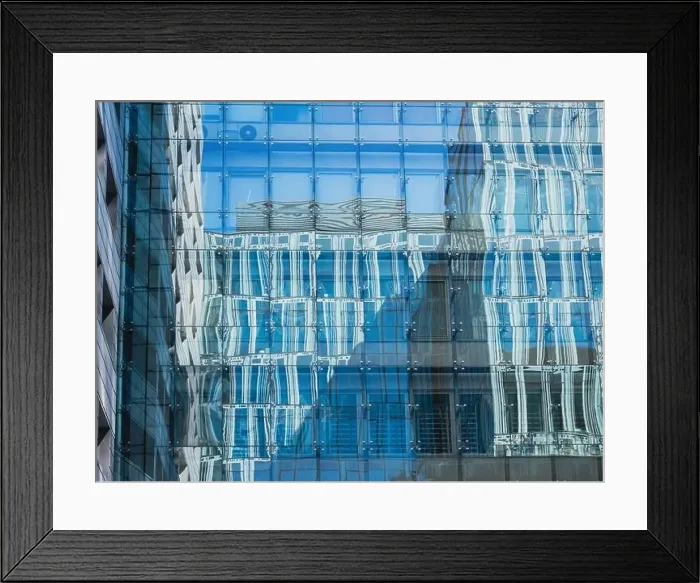 Framed Print : modern glass building mirror reflections. front view of modern glass building Framed Print : modern glass building mirror reflections. front view of modern glass building