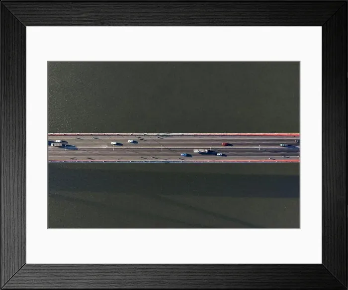 Framed Print : Top ascending aerial view of cable- stayed Can Tho bridge road with driving cars Framed Print : Top ascending aerial view of cable- stayed Can Tho bridge road with driving cars