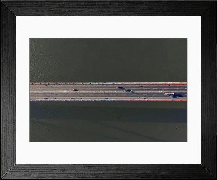 Framed Print : Top ascending aerial view of cable- stayed Can Tho bridge road with driving cars Framed Print : Top ascending aerial view of cable- stayed Can Tho bridge road with driving cars