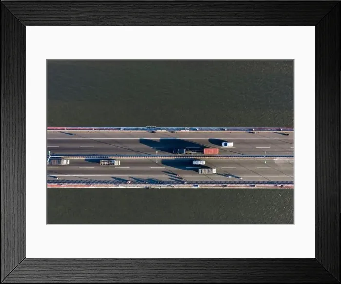 Framed Print : Top ascending aerial view of cable- stayed Can Tho bridge road with driving cars Framed Print : Top ascending aerial view of cable- stayed Can Tho bridge road with driving cars