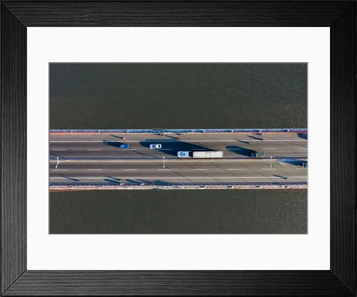 Framed Print : Top ascending aerial view of cable- stayed Can Tho bridge road with driving cars Framed Print : Top ascending aerial view of cable- stayed Can Tho bridge road with driving cars