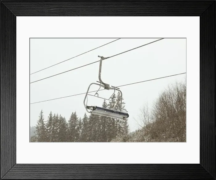 Framed Print : Empty ski lift in snowy day in Carpathians Framed Print : Empty ski lift in snowy day in Carpathians