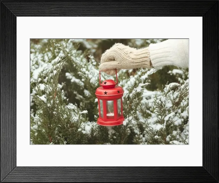 Framed Print : Female hand holds red lantern with burning candle Framed Print : Female hand holds red lantern with burning candle