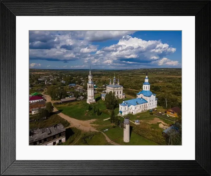Framed Print : Old churches and chapel on lawn against buildings in suburb Framed Print : Old churches and chapel on lawn against buildings in suburb