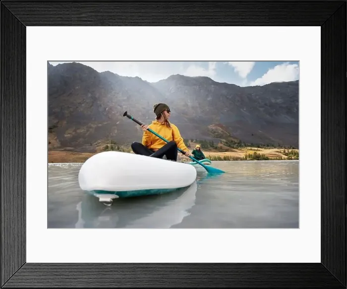 Framed Print : Two young girls walks on stand up paddle boards at mountain lake Framed Print : Two young girls walks on stand up paddle boards at mountain lake