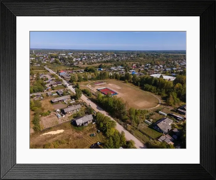 Framed Print : Road between lush trees and houses in autumn Framed Print : Road between lush trees and houses in autumn