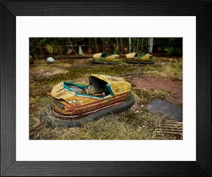 Framed Print : Abandoned bumper cars in the amusement park in ghost town of Pripyat city in Chernobyl Exclusion Zone, Ukraine