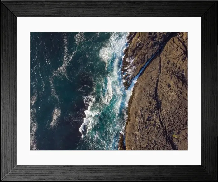 Framed Print : View from above. Bubbling turquoise ocean water and rocky shore Framed Print : View from above. Bubbling turquoise ocean water and rocky shore