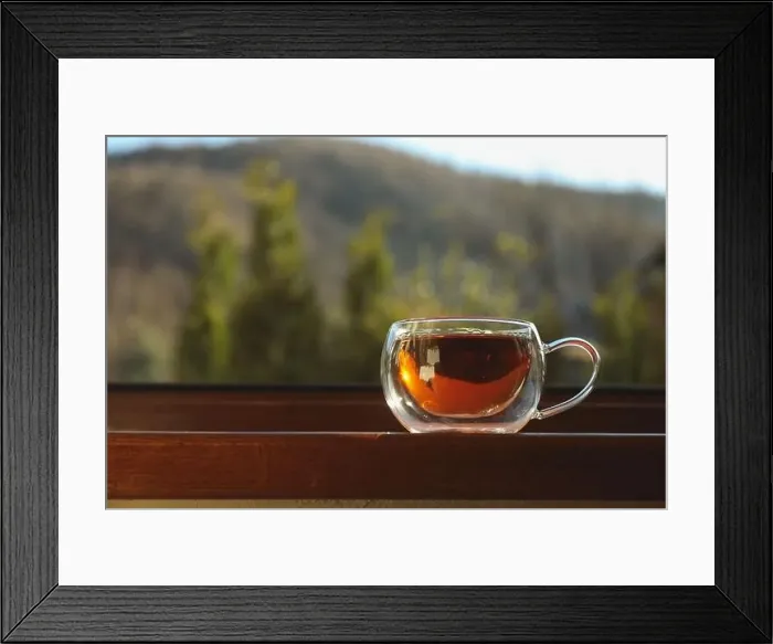 Framed Print : Cup of tea stands on wooden windowsill Framed Print : Cup of tea stands on wooden windowsill