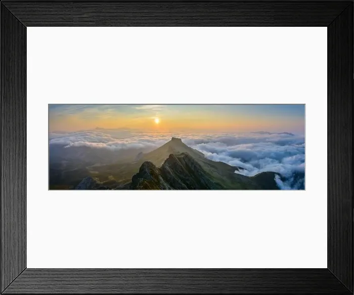 Framed Print : Picturesque aerial view of green mountain range and thick clouds located against morning sky with bright sunrise sun