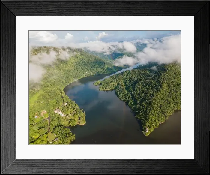 Framed Print : Drone view of calm winding lake streaming through hilly valley covered with dense forest and clouds