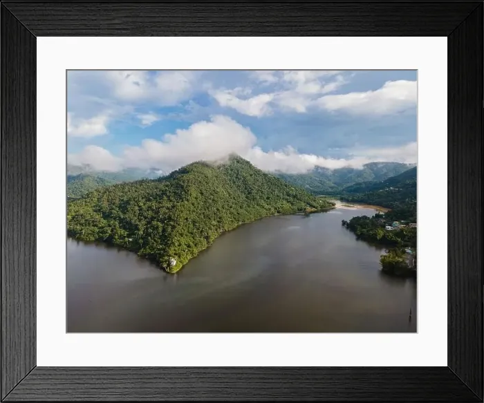 Framed Print : Drone view of calm winding lake streaming through hilly valley covered with dense forest and clouds Framed Print : Drone view of calm winding lake streaming through hilly valley covered with dense forest and clouds