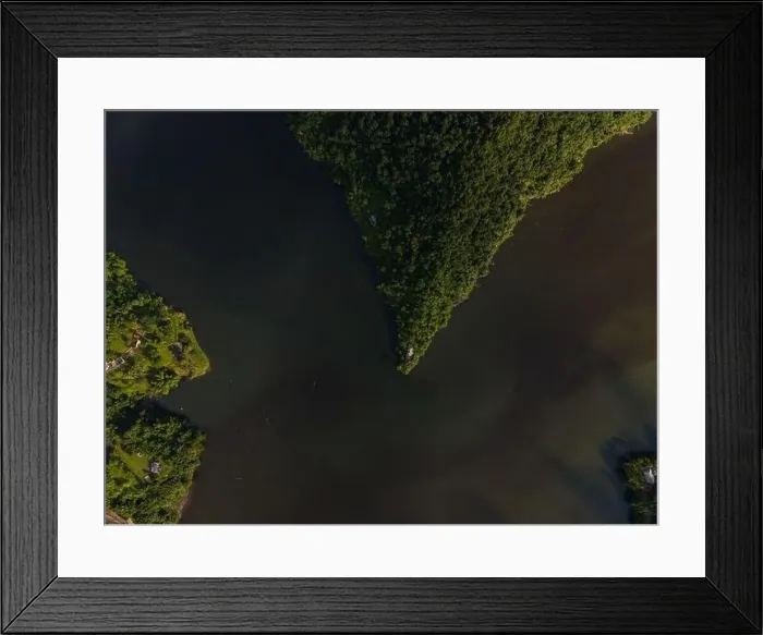Framed Print : Drone view of calm winding lake streaming through hilly valley covered with dense forest Framed Print : Drone view of calm winding lake streaming through hilly valley covered with dense forest