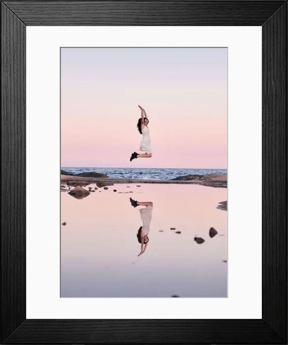 Framed Print : Happy woman jumping reflected in the water Framed Print : Happy woman jumping reflected in the water