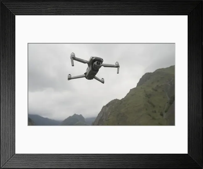 Framed Print : Landscape of empty mountains. Action. Mountains of gray flowers with a misty sky over which the drone flies and shoots Framed Print : Landscape of empty mountains. Action. Mountains of gray flowers with a misty sky over which the drone flies and shoots