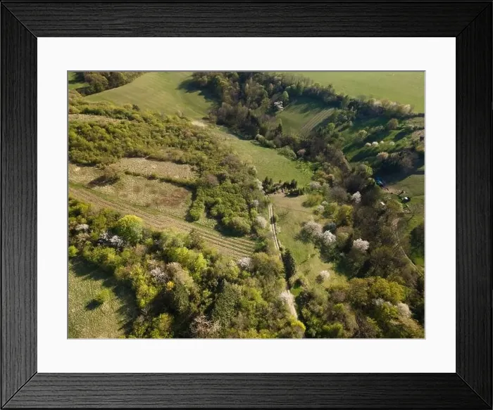 Framed Print : Drone flight over green meadows, forests, landscape, nature in April in Austria Framed Print : Drone flight over green meadows, forests, landscape, nature in April in Austria