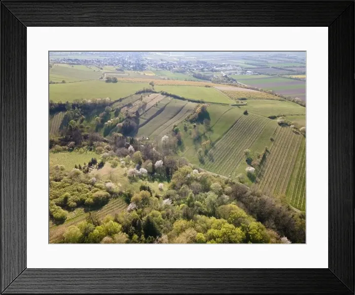 Framed Print : Drone flight over green meadows, forests, landscape, nature in April in Austria Framed Print : Drone flight over green meadows, forests, landscape, nature in April in Austria