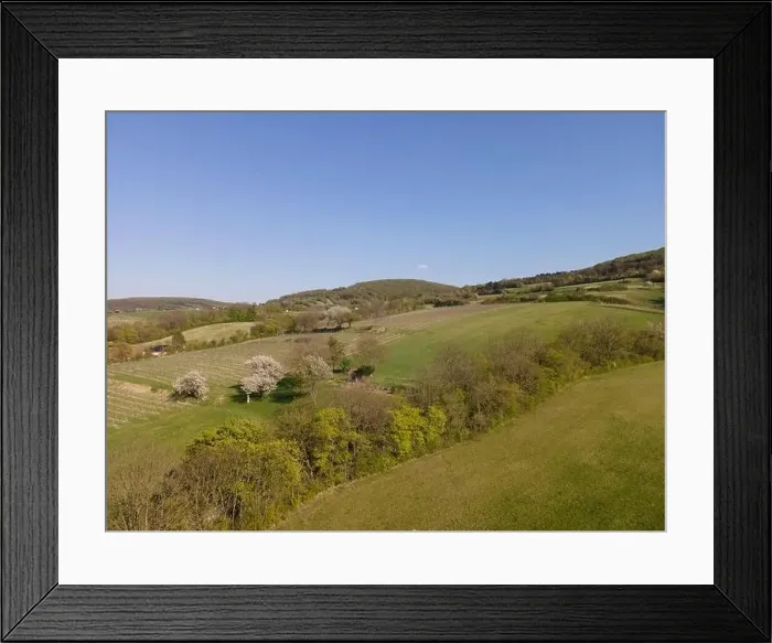 Framed Print : Drone flight over green meadows, forests, landscape, nature in April in Austria Framed Print : Drone flight over green meadows, forests, landscape, nature in April in Austria