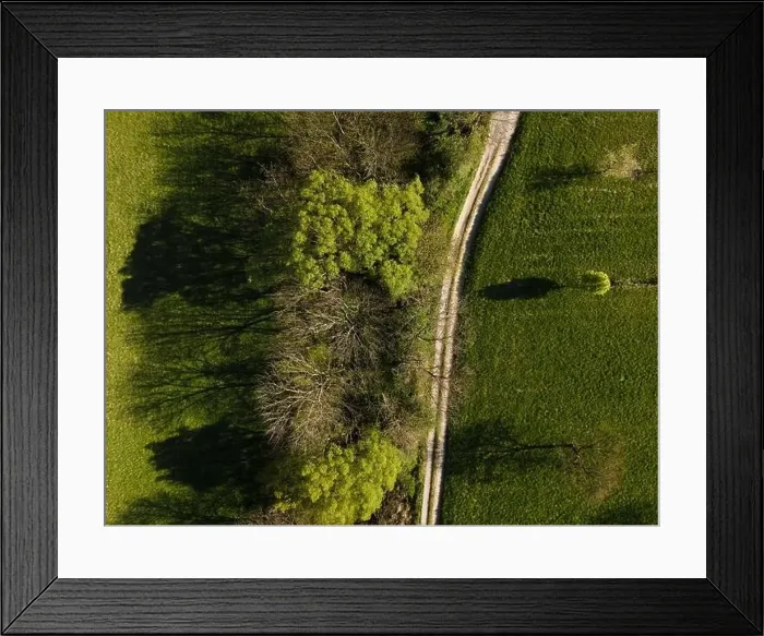 Framed Print : Drone flight over green meadows, forests, landscape, nature in April in Austria Framed Print : Drone flight over green meadows, forests, landscape, nature in April in Austria