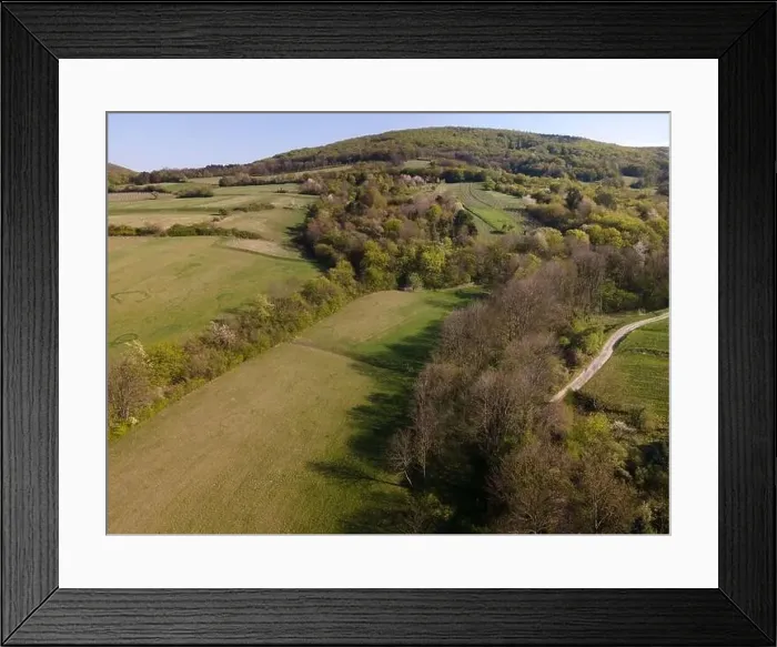 Framed Print : Drone flight over green meadows, forests, landscape, nature in April in Austria Framed Print : Drone flight over green meadows, forests, landscape, nature in April in Austria
