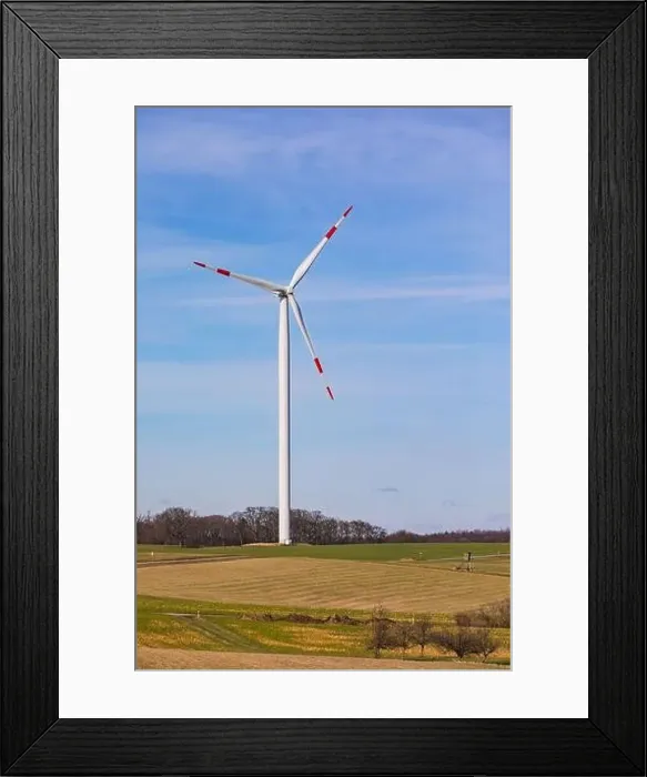 Framed Print : A red and white wind turbine on a mountain against a blue sky Framed Print : A red and white wind turbine on a mountain against a blue sky