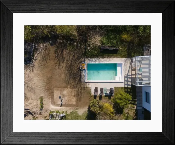 Framed Print : Drone flight over fresh earth area with grass grown next to pool construction site in April Framed Print : Drone flight over fresh earth area with grass grown next to pool construction site in April