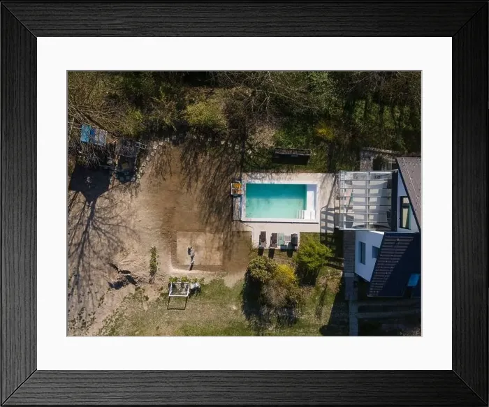 Framed Print : Drone flight over fresh earth area with grass grown next to pool construction site in April Framed Print : Drone flight over fresh earth area with grass grown next to pool construction site in April