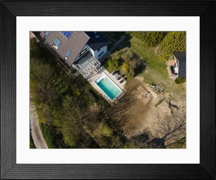 Framed Print : Drone flight over fresh earth area with grass grown next to pool construction site in April Framed Print : Drone flight over fresh earth area with grass grown next to pool construction site in April