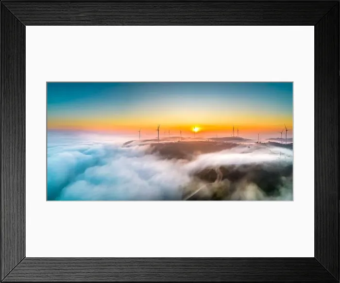 Framed Print : Aerial view top hill at dawn with fog covering small village in valley Framed Print : Aerial view top hill at dawn with fog covering small village in valley