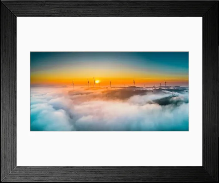 Framed Print : Aerial view top hill at dawn with fog covering small village in valley Framed Print : Aerial view top hill at dawn with fog covering small village in valley