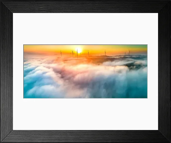 Framed Print : Aerial view top hill at dawn with fog covering small village in valley