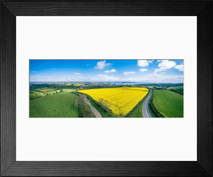 Framed Print : Panorama over Farmlands and Rapeseed fields from a drone, Devon, England Framed Print : Panorama over Farmlands and Rapeseed fields from a drone, Devon, England