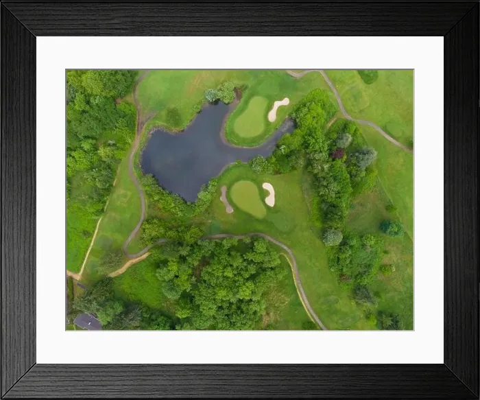 Framed Print : Shooting from a drone. Green meadow with walking paths and a lake Framed Print : Shooting from a drone. Green meadow with walking paths and a lake