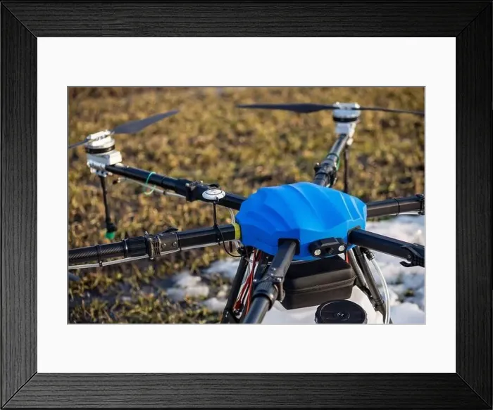 Framed Print : A beautiful blue agrodron stands on the field Framed Print : A beautiful blue agrodron stands on the field