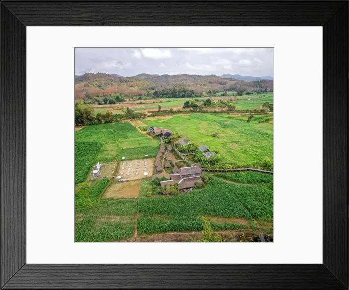 Framed Print : Aerial view of Houses in the middle of rice fields in Nan province, Thailand Framed Print : Aerial view of Houses in the middle of rice fields in Nan province, Thailand